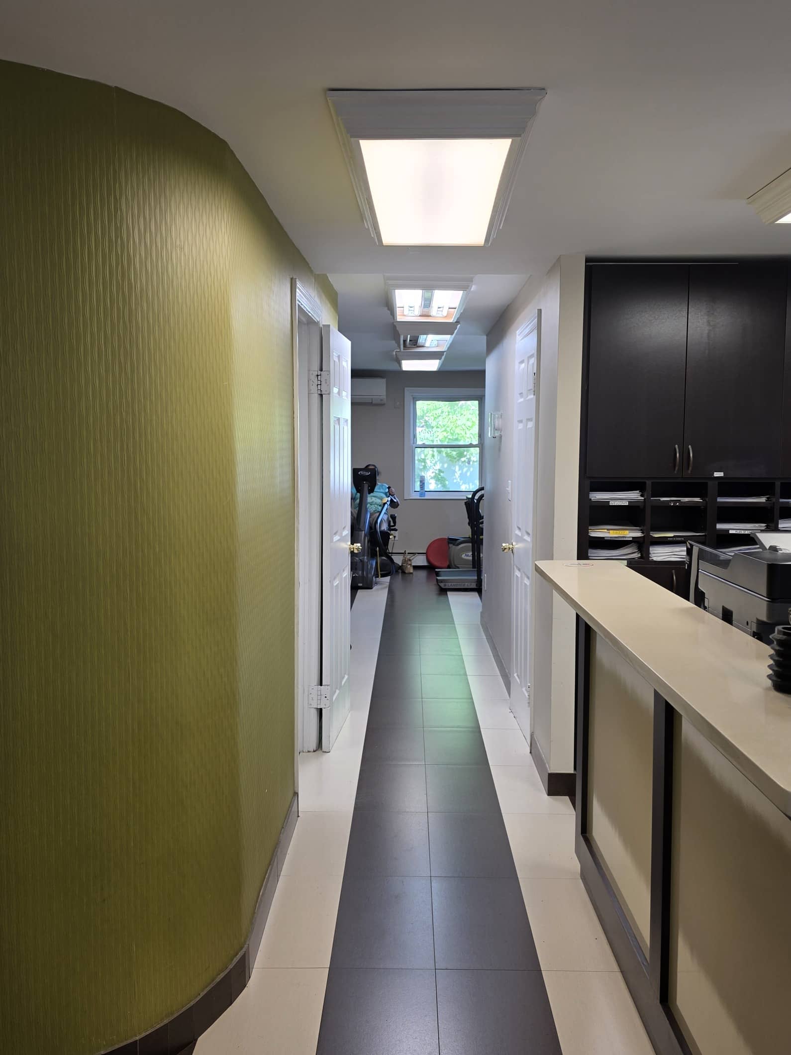 Hallway inside the Glen Oaks clinic leading toward the rehab area